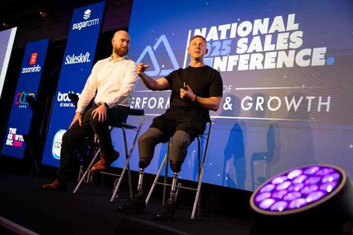 Aaron Phipps MBE and performance coach John Cooper speaking on the NSC stage about their 
